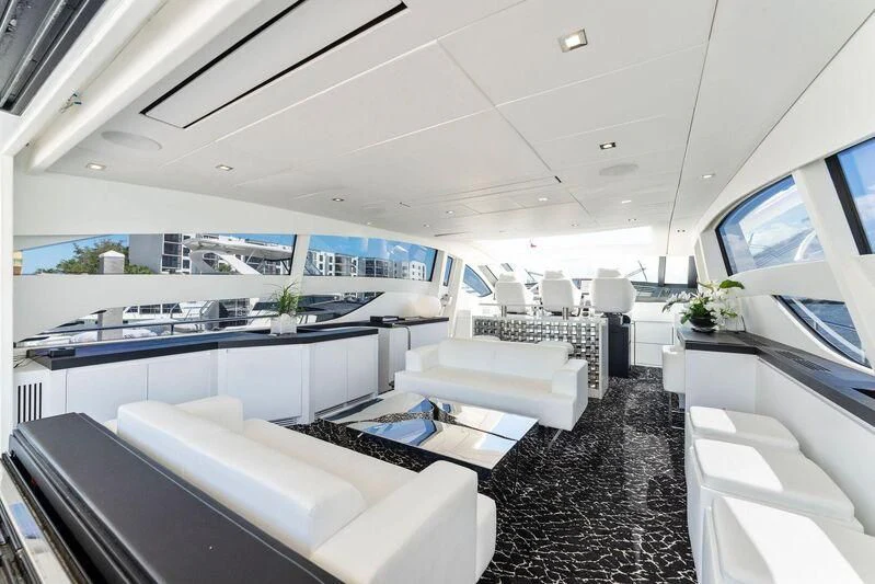 a room with a couch and a table aboard HAWK Yacht for Charter