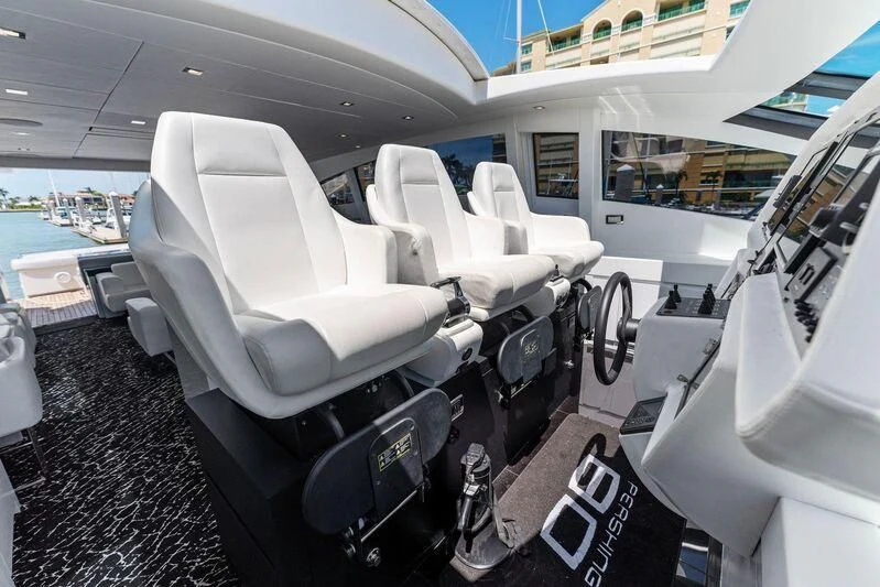 a white car with seats aboard HAWK Yacht for Charter