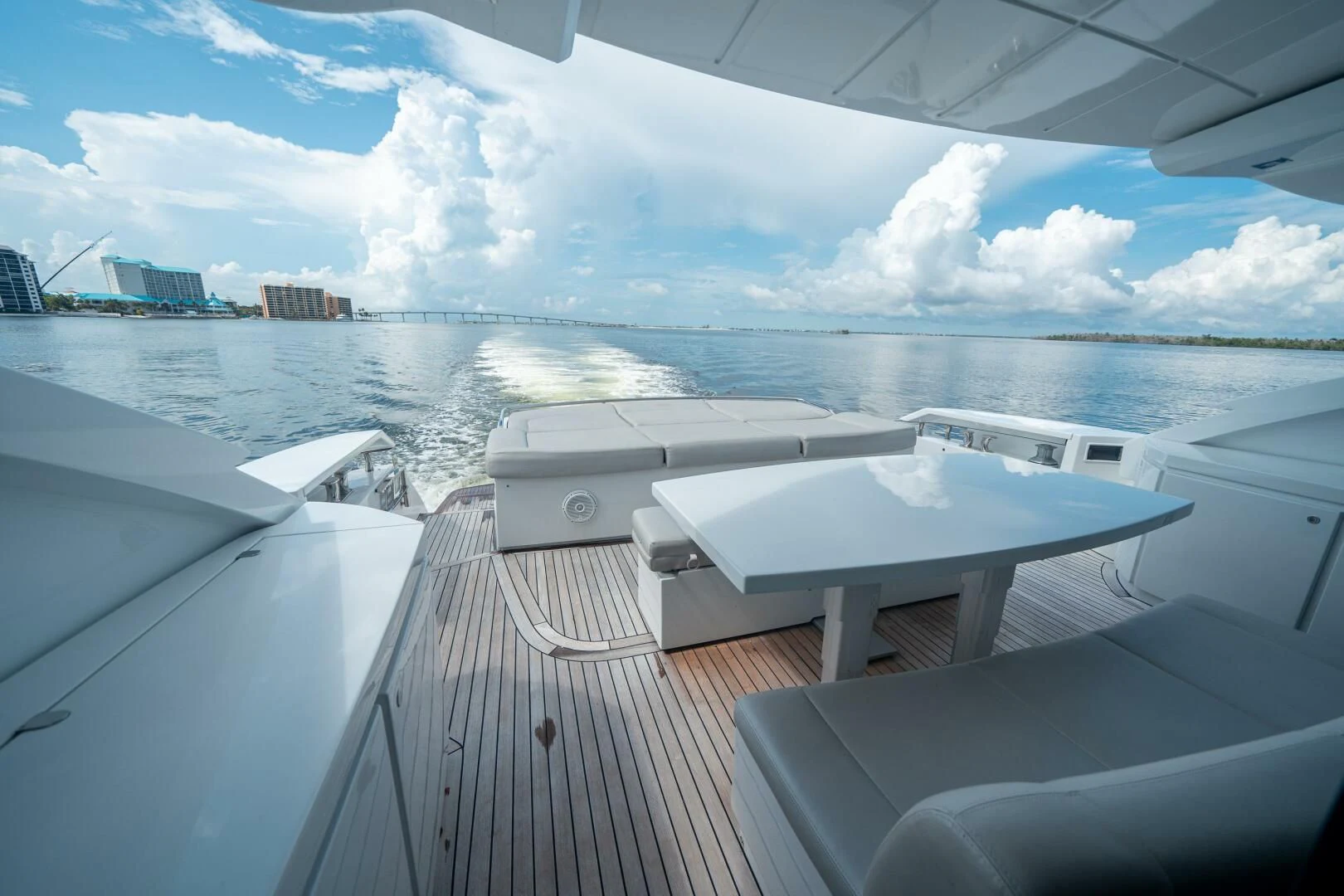 a deck with a view of the water and the city below aboard HAWK Yacht for Charter
