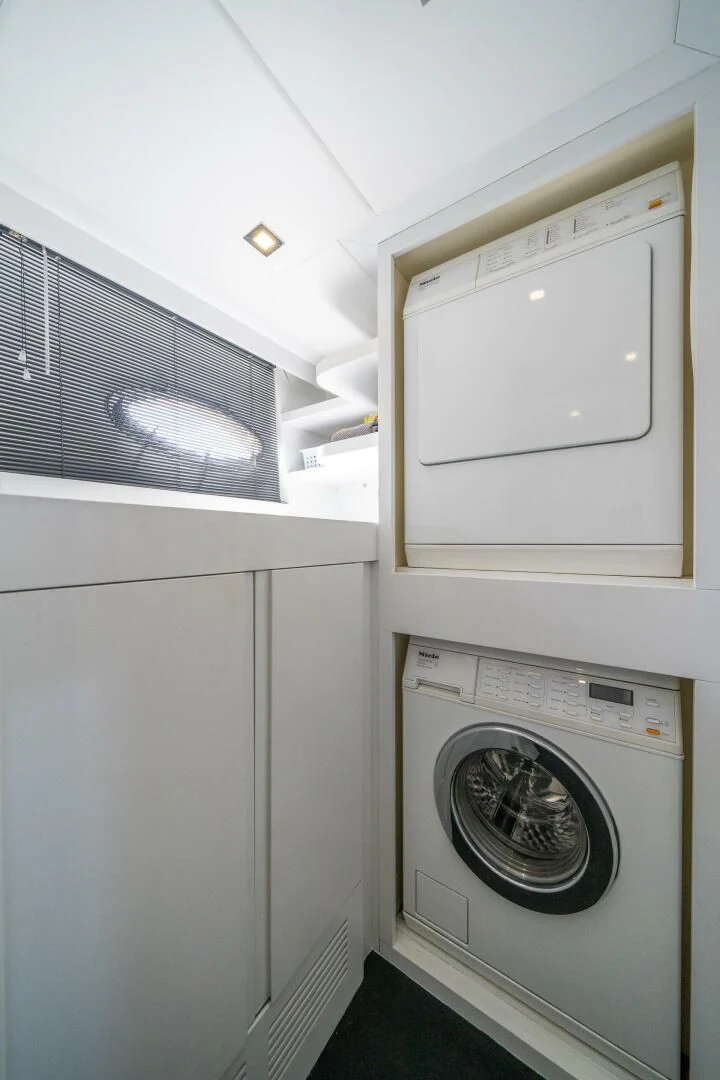 a white washing machine aboard HAWK Yacht for Charter