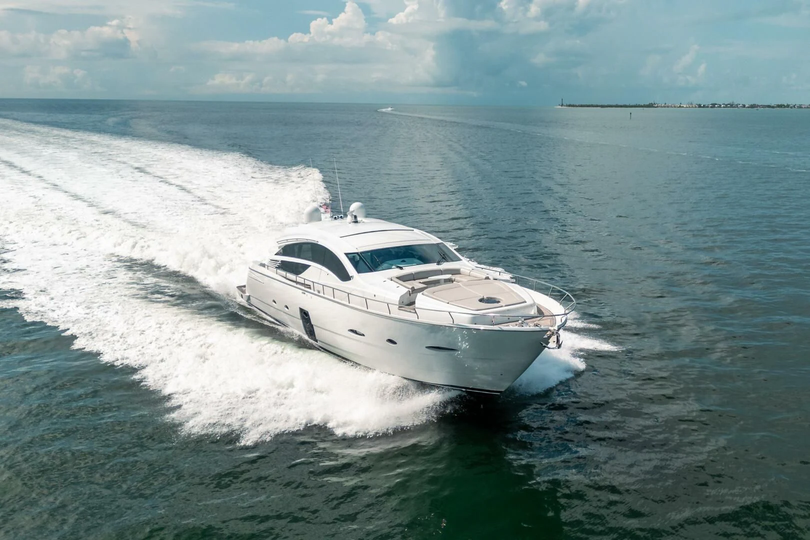 a white boat on the water aboard HAWK Yacht for Charter