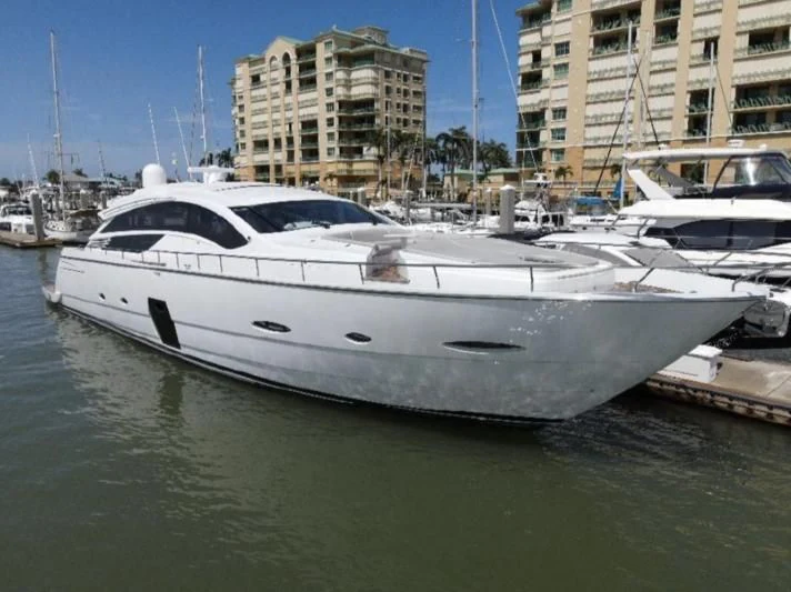 a white yacht in a harbor aboard HAWK Yacht for Charter