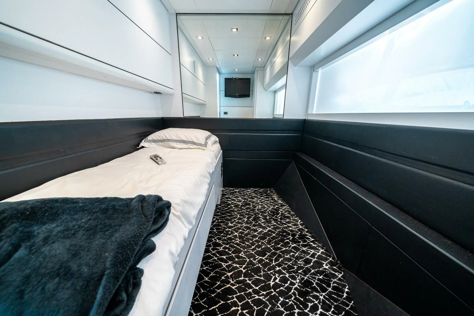 a small room with a bed aboard HAWK Yacht for Charter