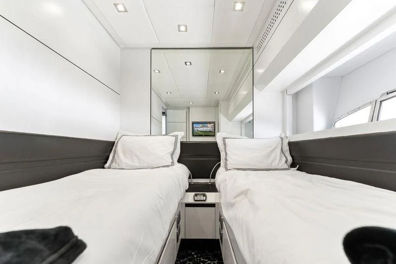 a room with two beds aboard HAWK Yacht for Charter