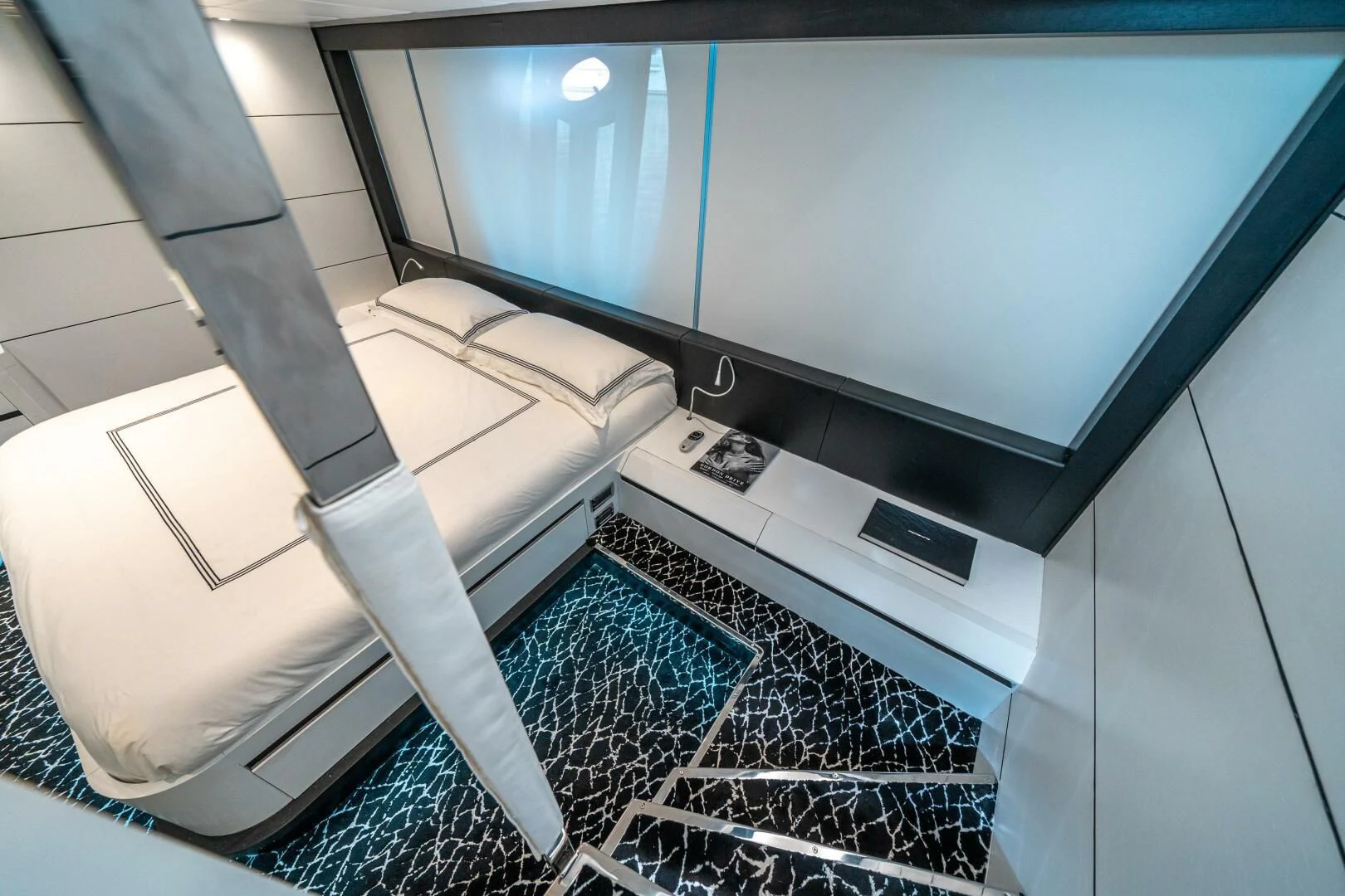 a white chair in a room aboard HAWK Yacht for Charter