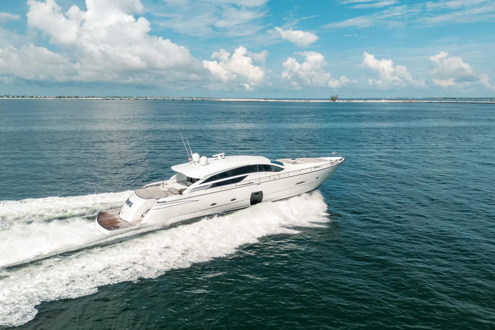 a white boat in the water aboard HAWK Yacht for Charter