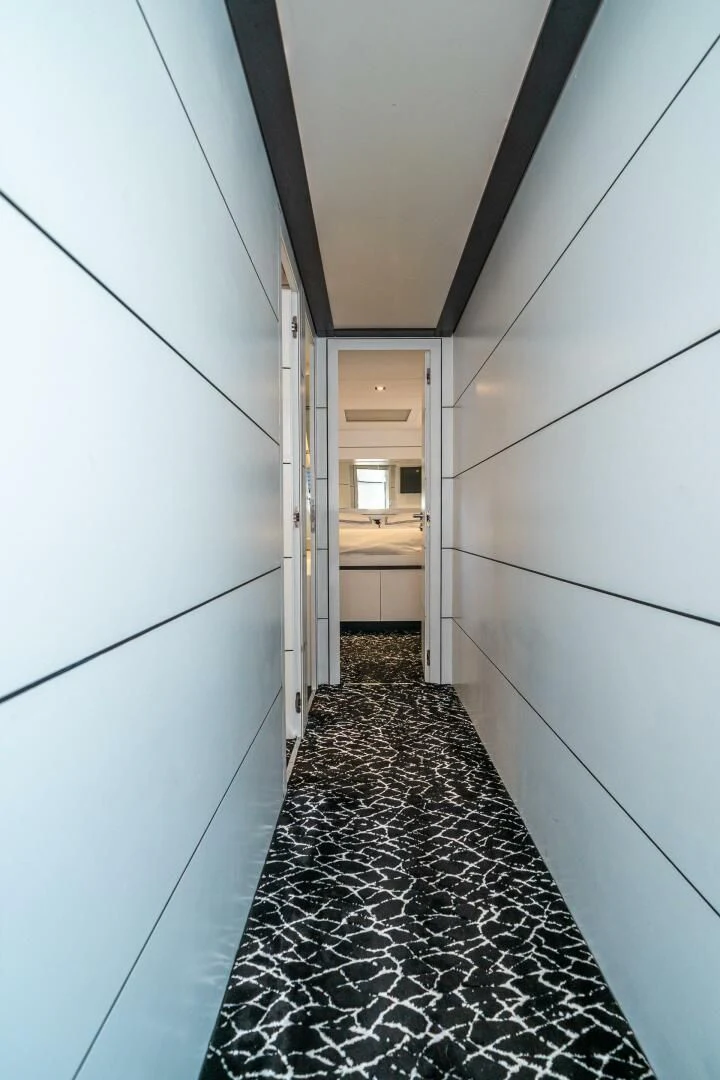 a hallway with a tile floor aboard HAWK Yacht for Charter