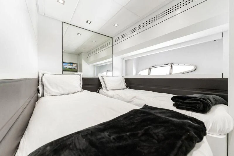 a room with two beds aboard HAWK Yacht for Charter