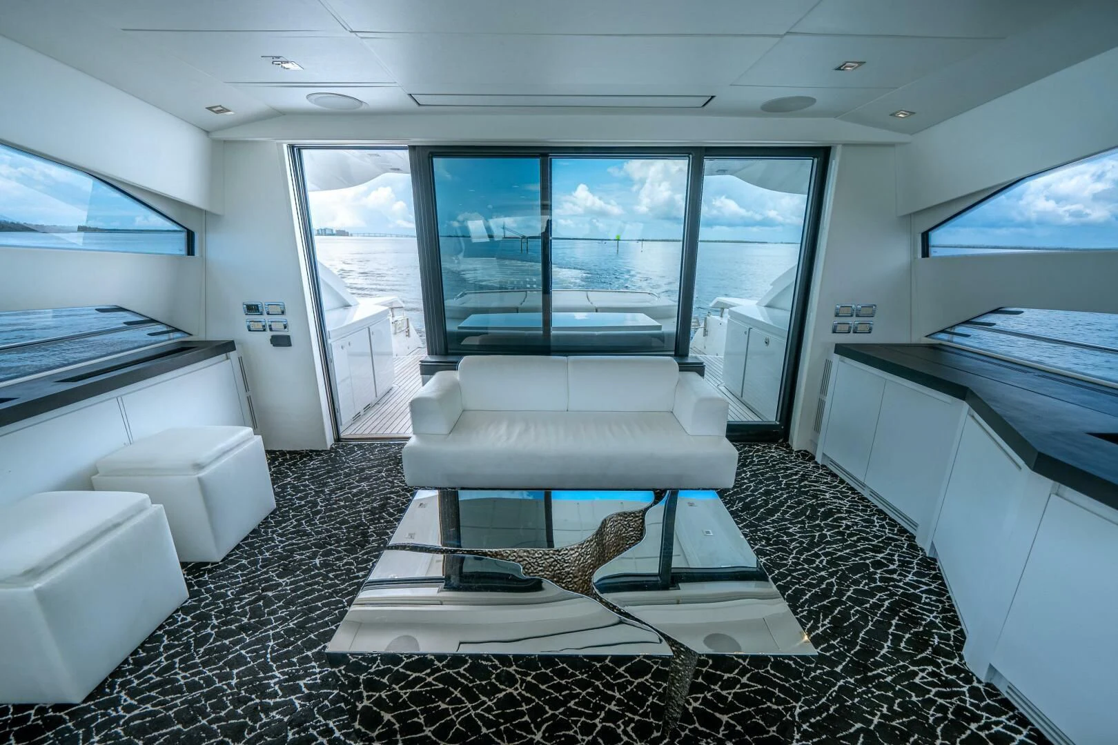 a room with a couch and a table aboard HAWK Yacht for Charter