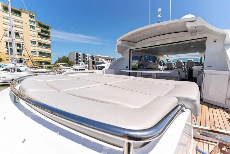 a white boat on a dock aboard HAWK Yacht for Charter