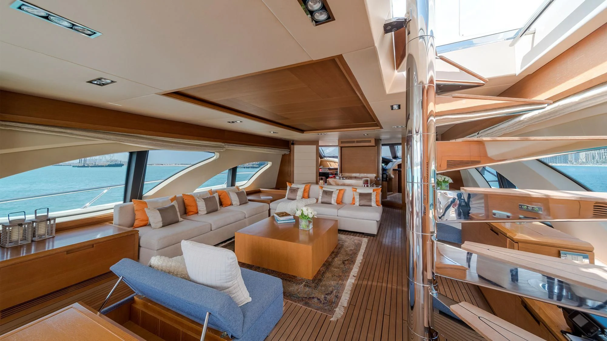 a boat with a deck and a view of the ocean aboard SHELLS Yacht for Sale