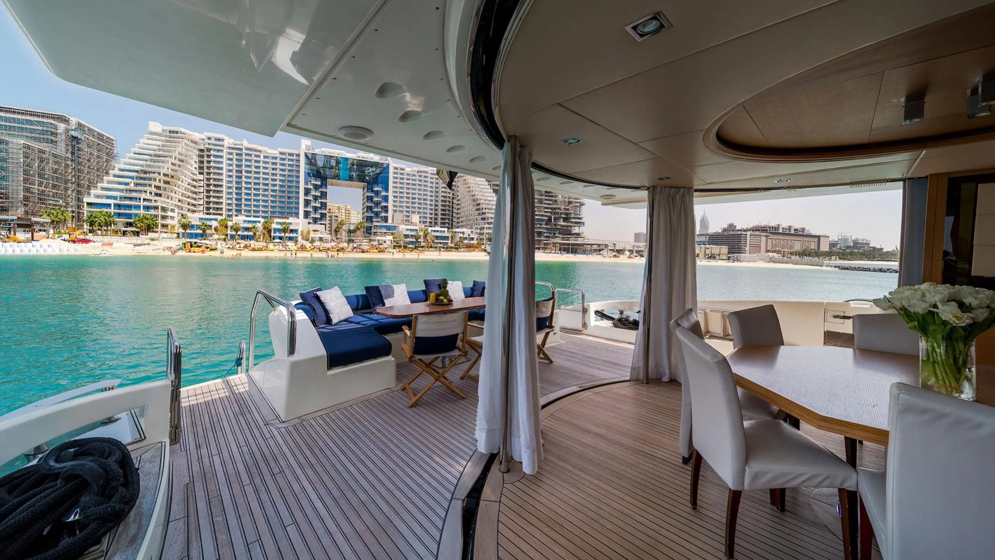 a deck with a large pool aboard SHELLS Yacht for Sale