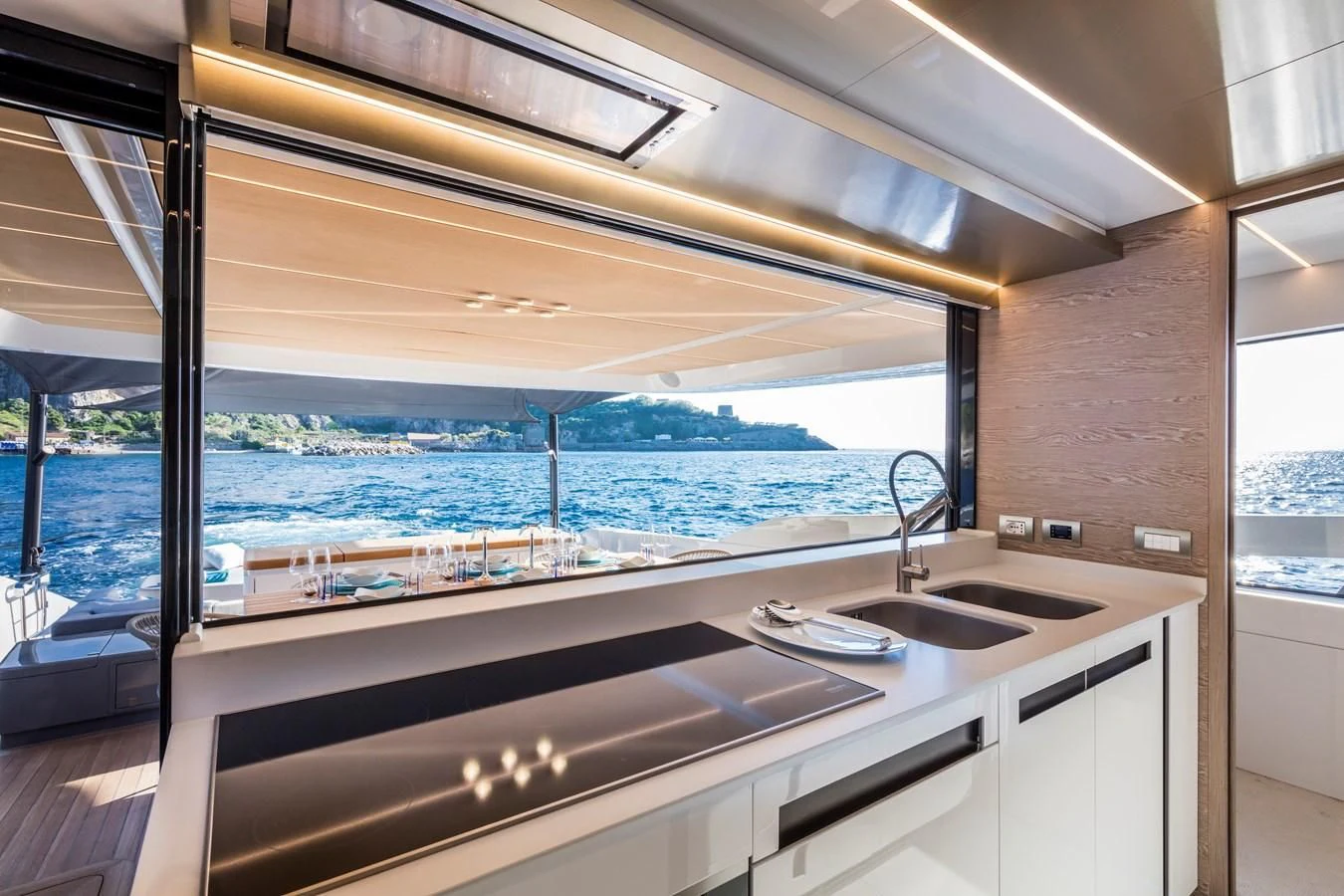 a kitchen with a view of the ocean aboard D&B Yacht for Sale