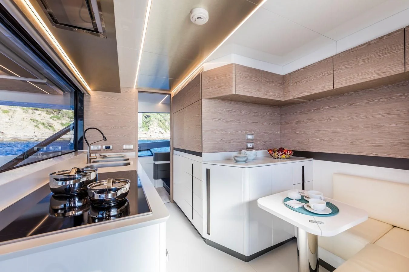 a kitchen with a table and a sink aboard D&B Yacht for Sale