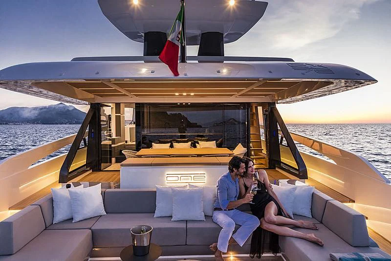 a couple sitting on a boat aboard D&B Yacht for Sale