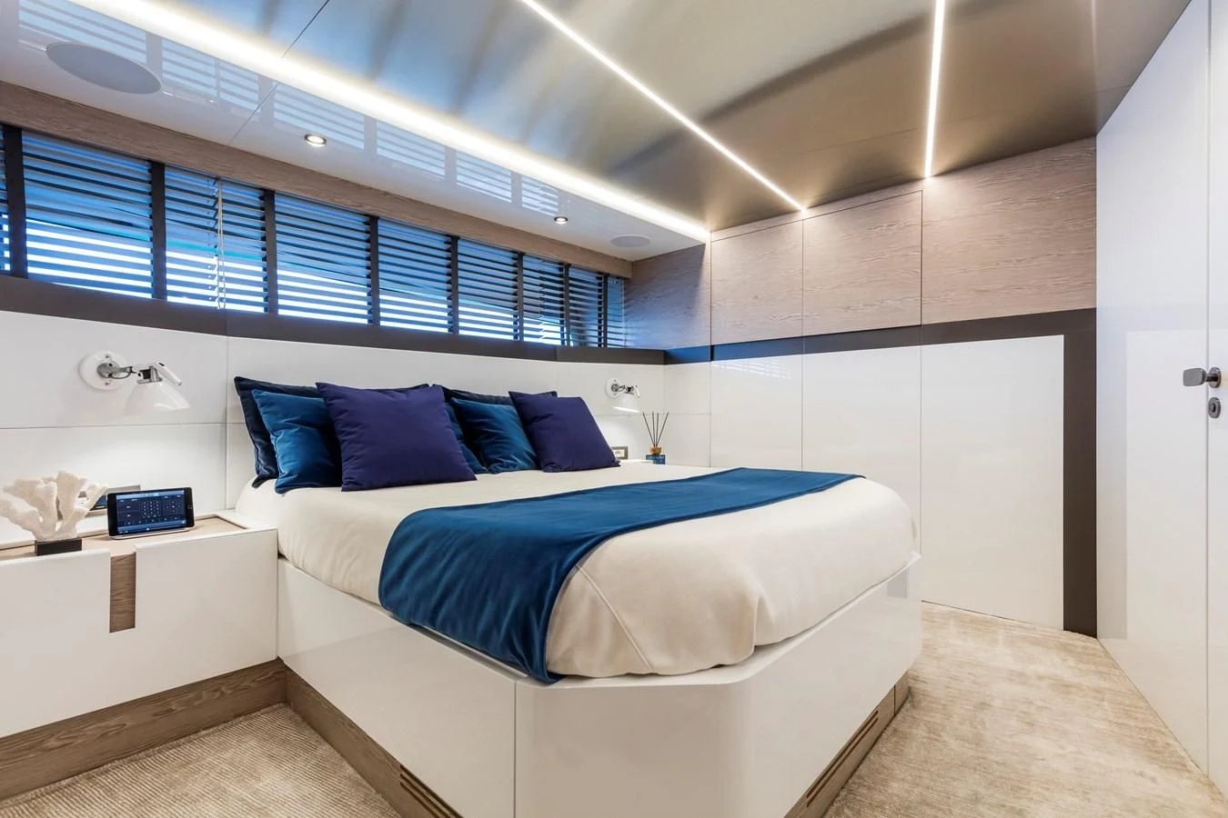 a room with a bed and a desk aboard D&B Yacht for Sale