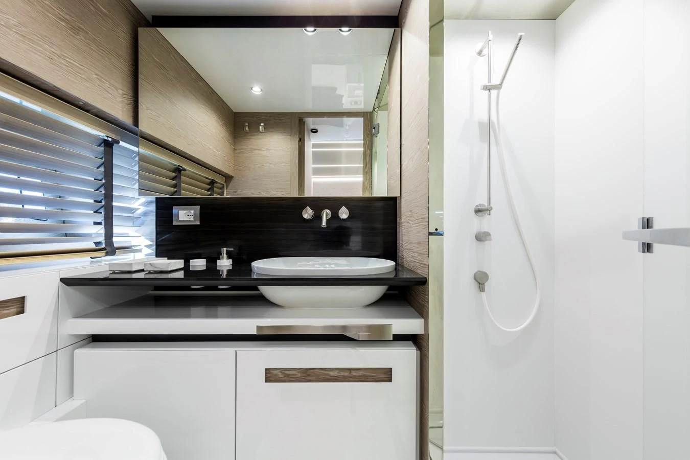 a bathroom with a sink and a mirror aboard D&B Yacht for Sale