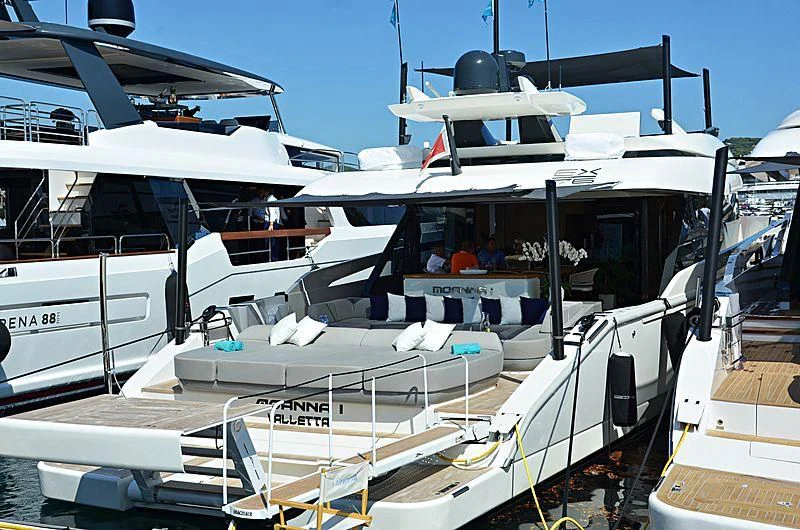 a boat with a helicopter on the deck aboard D&B Yacht for Sale
