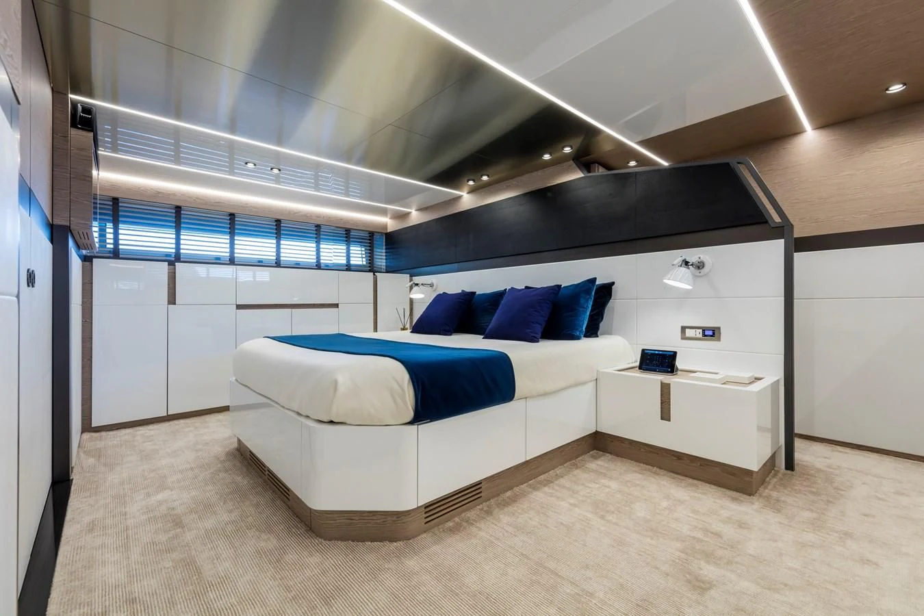 a room with a bed and a desk aboard D&B Yacht for Sale