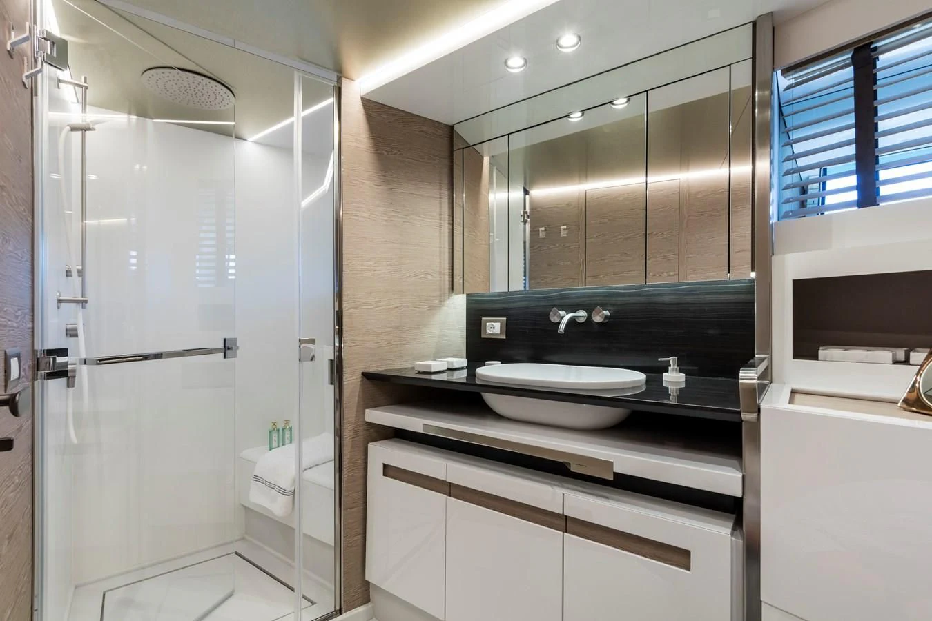 a kitchen with a sink and cabinets aboard D&B Yacht for Sale