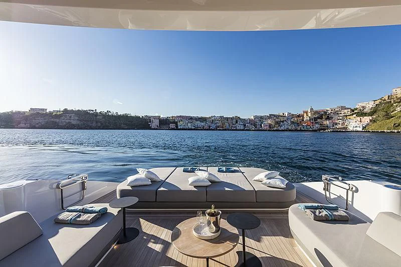 a large white boat on a deck overlooking a large body of water aboard D&B Yacht for Sale