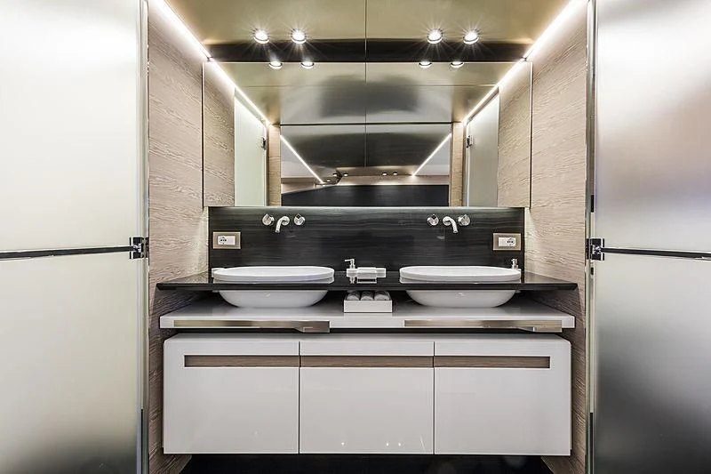 a kitchen with a stove and a refrigerator aboard D&B Yacht for Sale