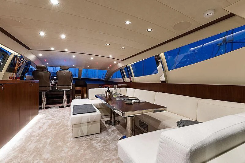 a room with a table and chairs aboard ONE DAY Yacht for Sale