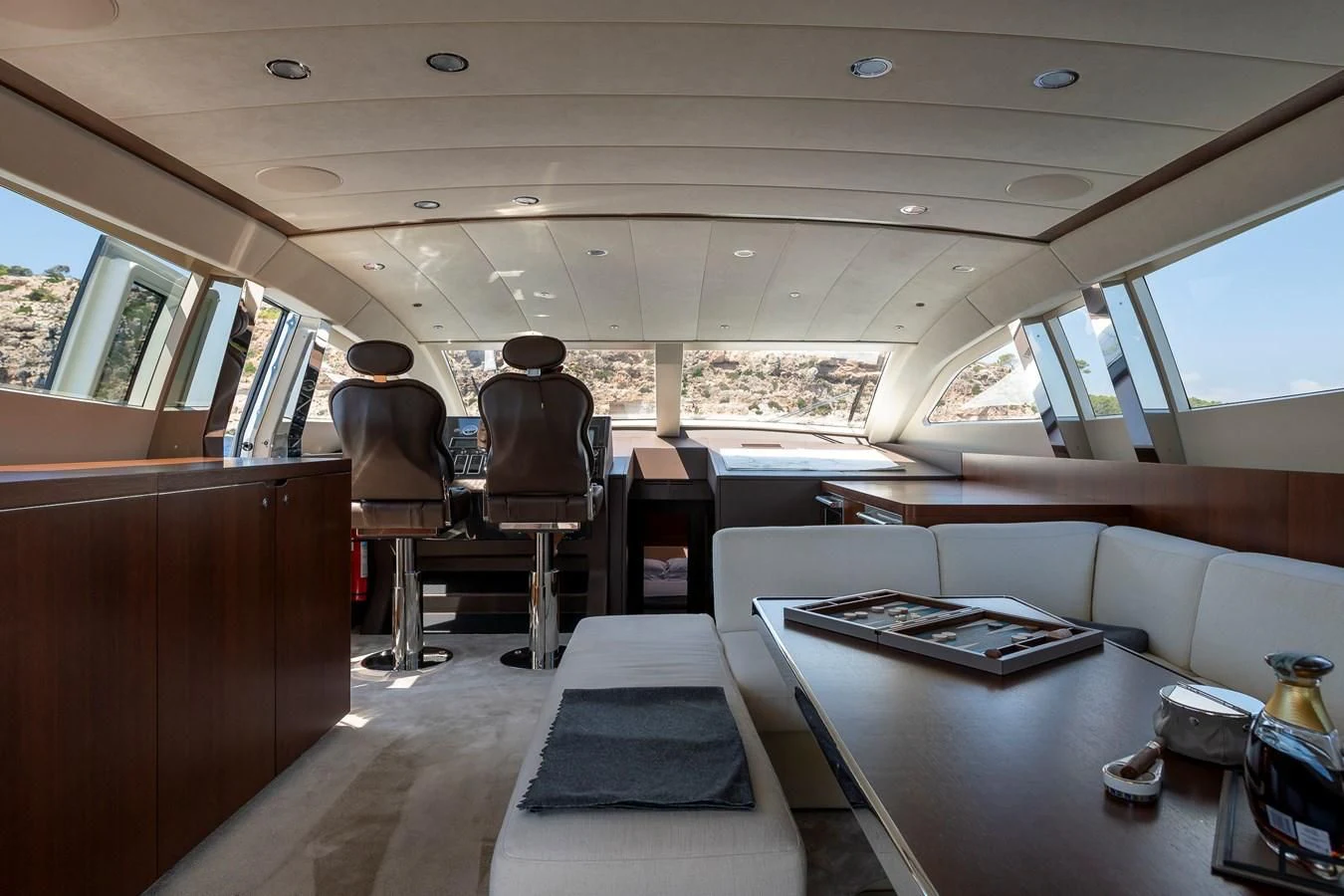 a train car with a table and chairs aboard ONE DAY Yacht for Sale