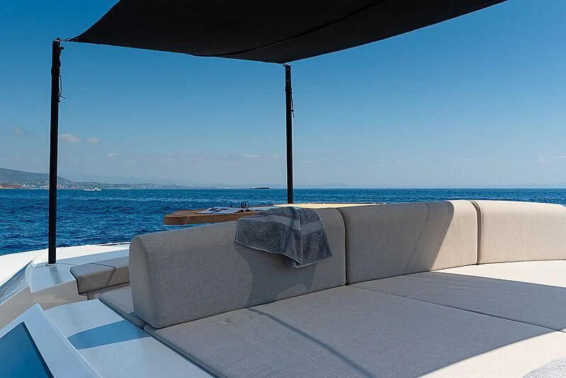 a lounge chair on a beach aboard ONE DAY Yacht for Sale