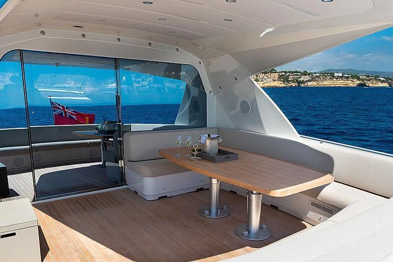 a room with a table and a view of the ocean aboard ONE DAY Yacht for Sale