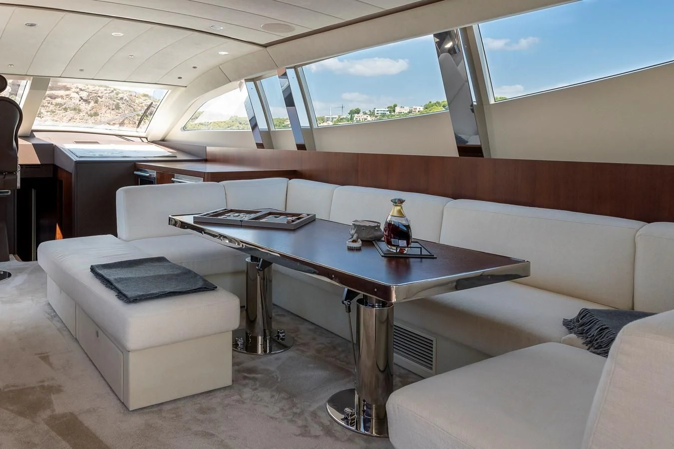 a room with a table and couches aboard ONE DAY Yacht for Sale