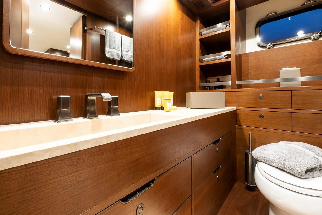 a bathroom with wooden cabinets aboard ONE DAY Yacht for Sale