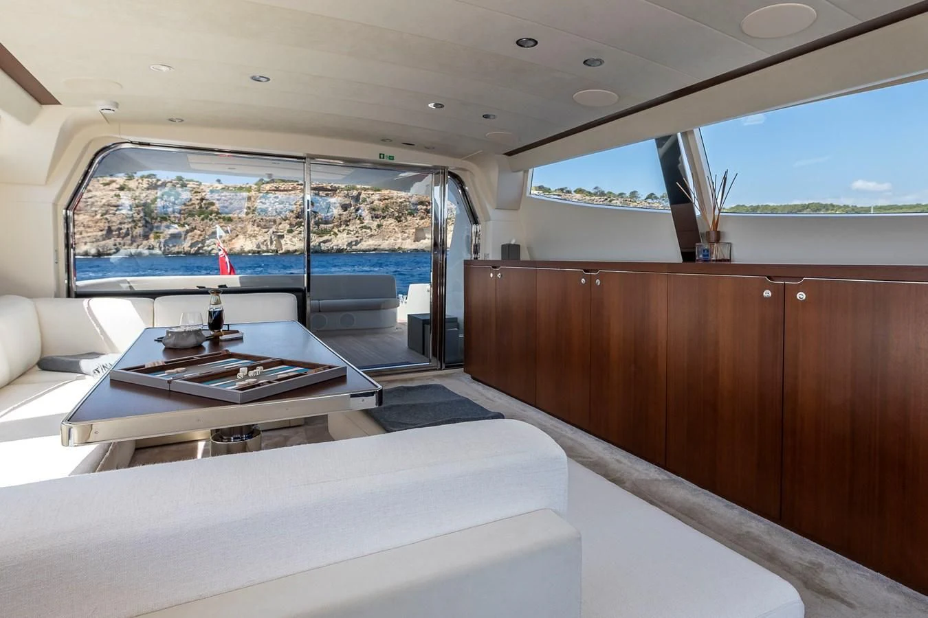 a room with a table and a window aboard ONE DAY Yacht for Sale