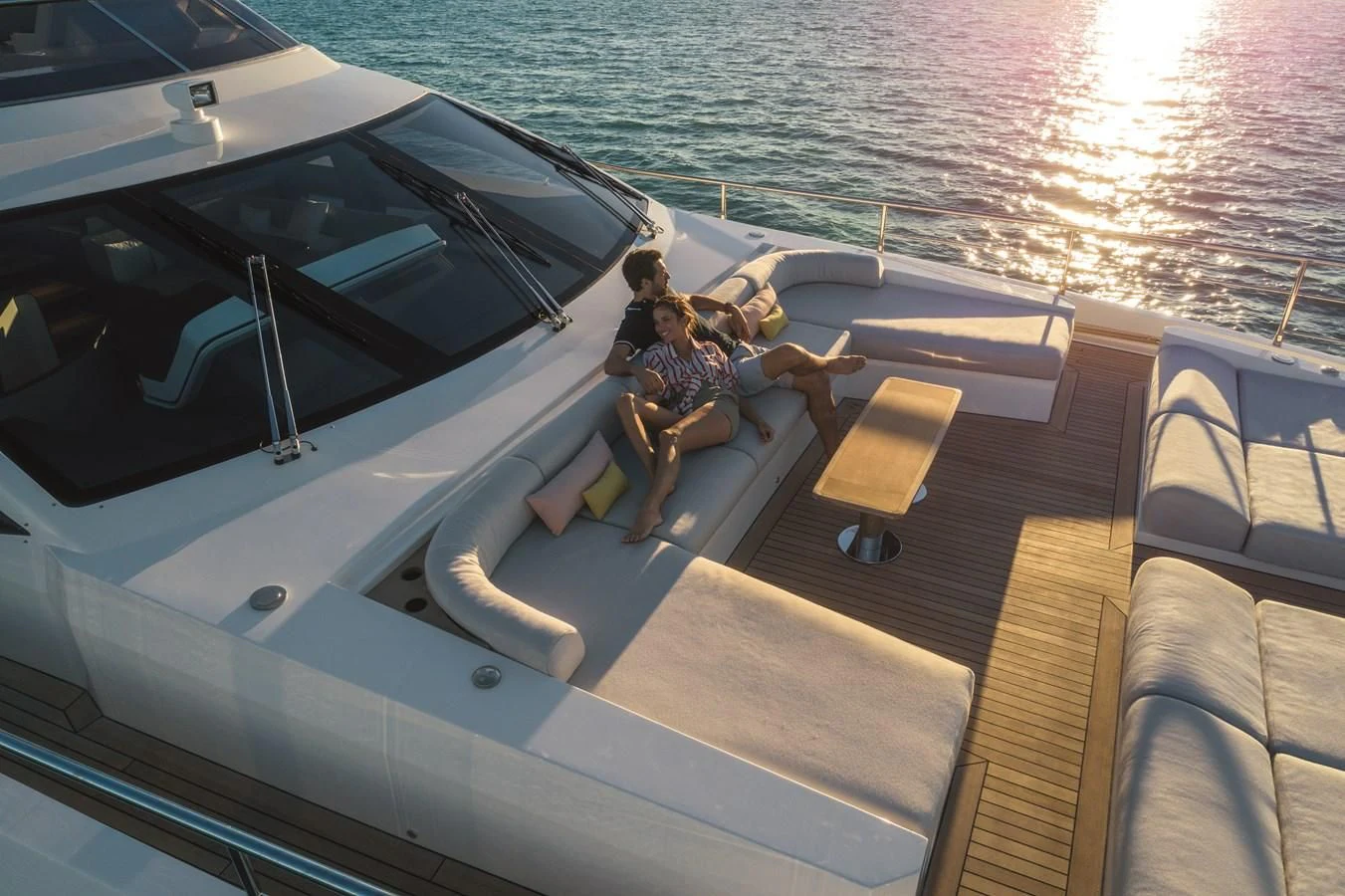 a group of people sitting on a boat aboard LA MAMA Yacht for Sale
