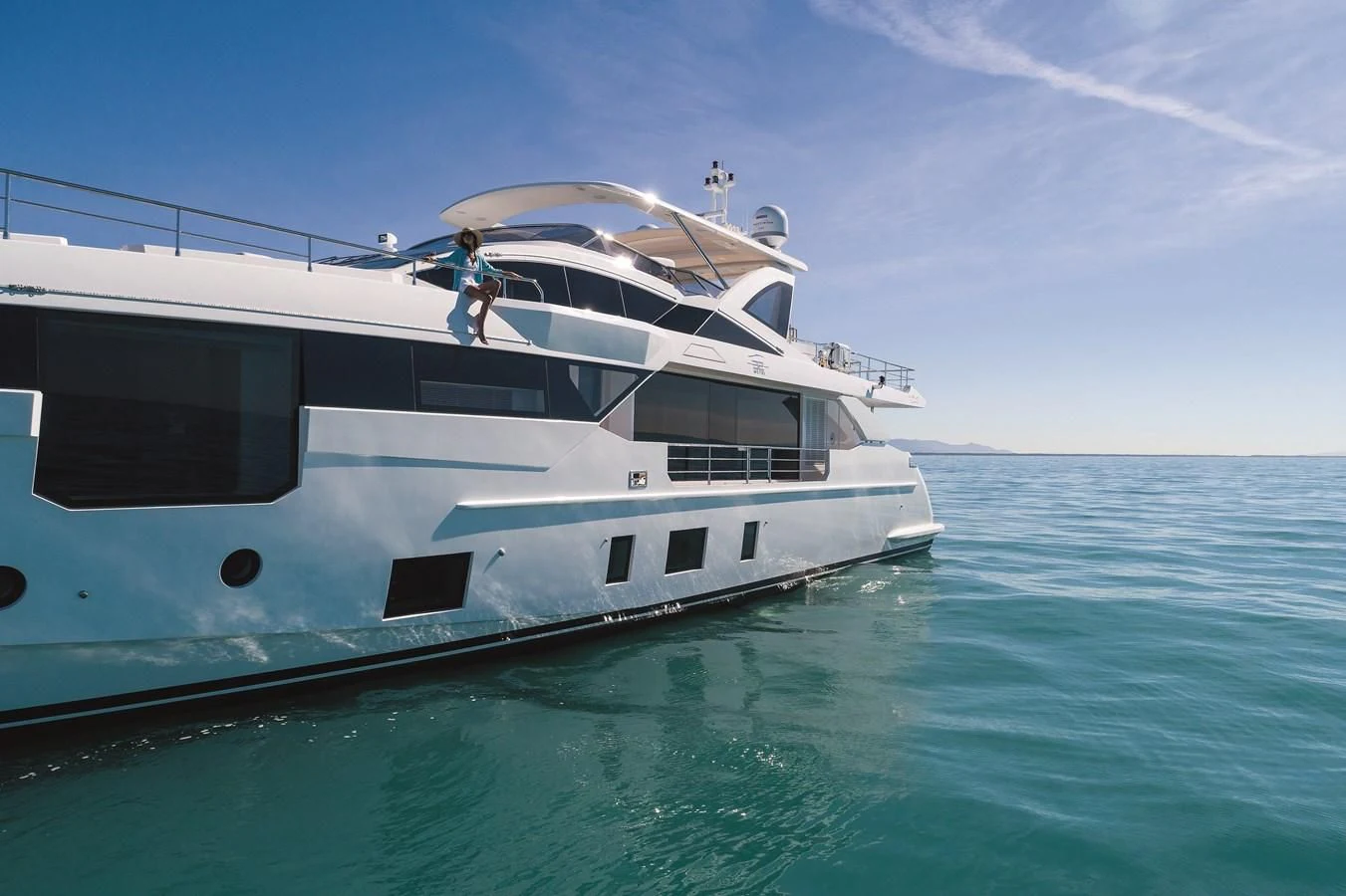 a person standing on a boat aboard LA MAMA Yacht for Sale