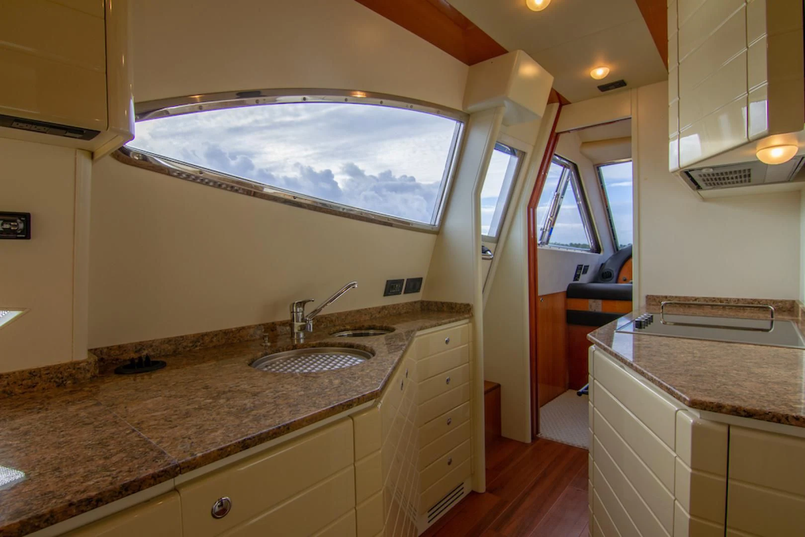 a large bathroom with a large marble counter top aboard SEA PAL Yacht for Sale