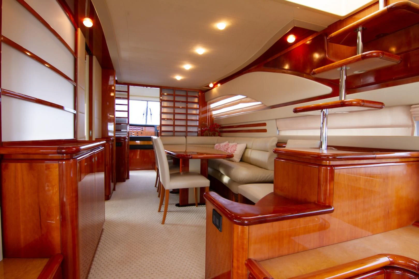 a room with a couch and a table and a large window aboard SEA PAL Yacht for Sale