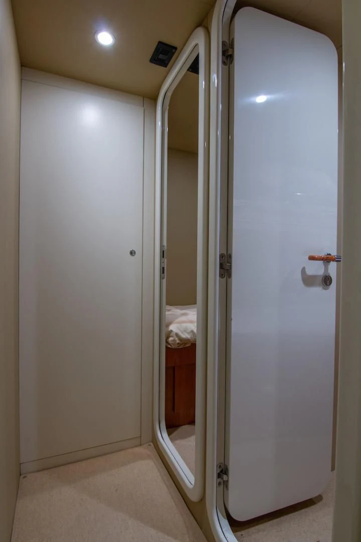 a white door with a mirror aboard SEA PAL Yacht for Sale