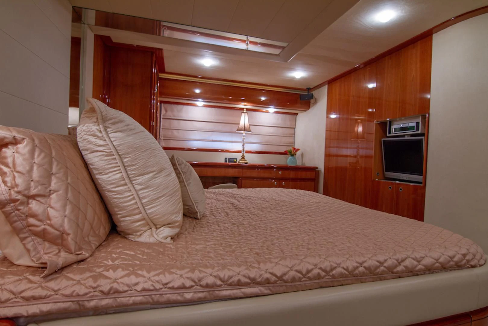 a bed with a white pillow aboard SEA PAL Yacht for Sale