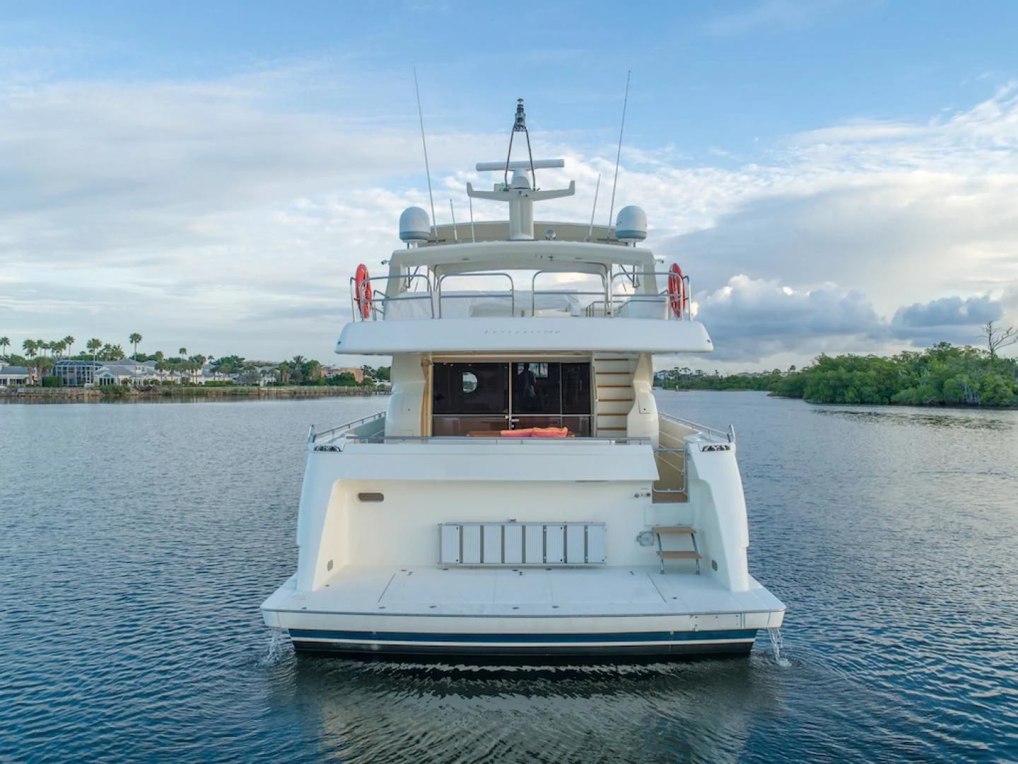 a white boat on the water aboard SEA PAL Yacht for Sale