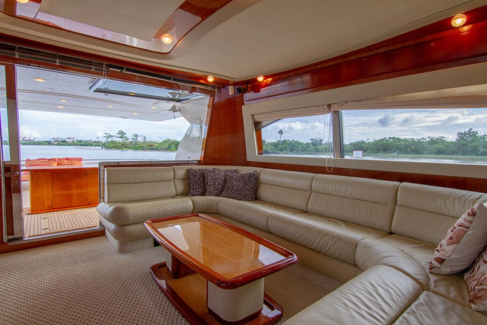 a living room with a couch and a table aboard SEA PAL Yacht for Sale