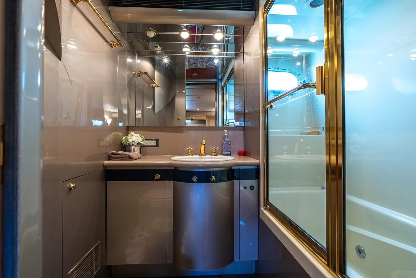 a bathroom with a sink and cabinets aboard SELF MADE Yacht for Sale