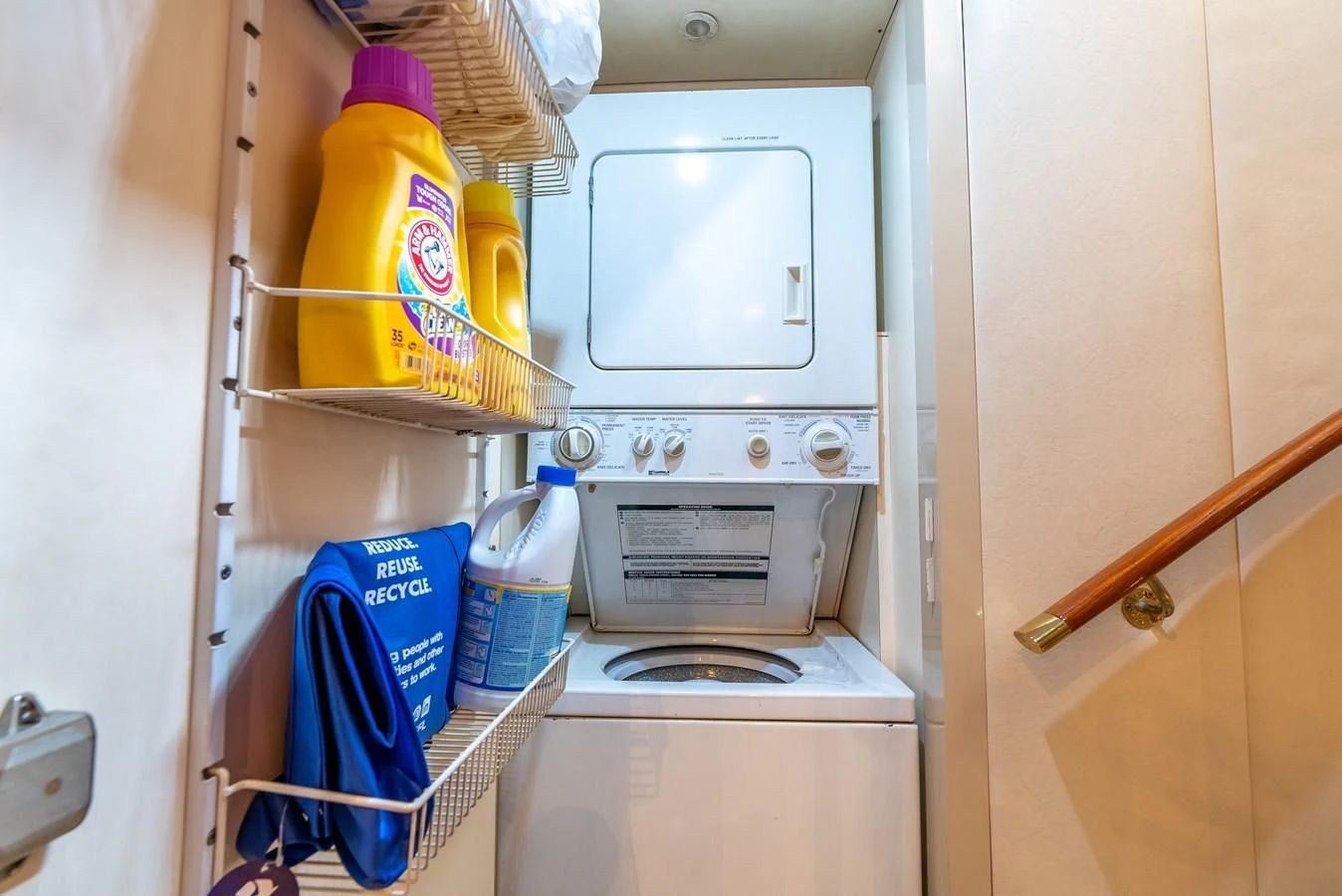 a white kitchen with a yellow and blue container and a yellow container with a yellow liquid in it aboard SELF MADE Yacht for Sale