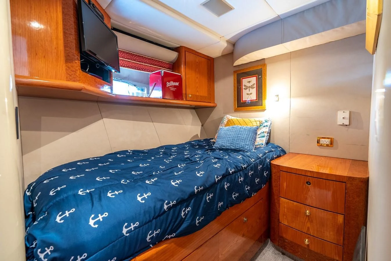 a bedroom with a bed and a television aboard SELF MADE Yacht for Sale