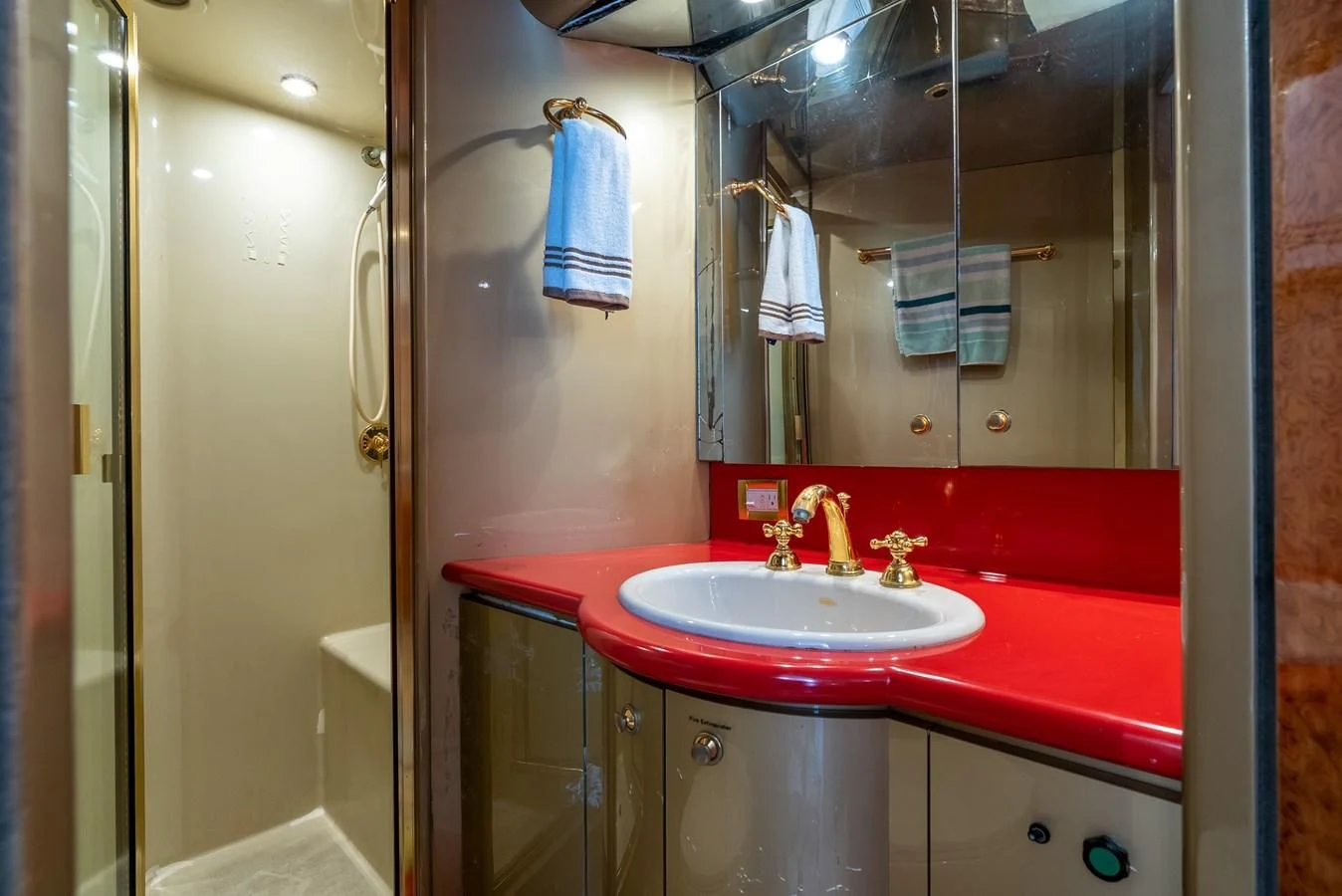 a bathroom with a red countertop aboard SELF MADE Yacht for Sale