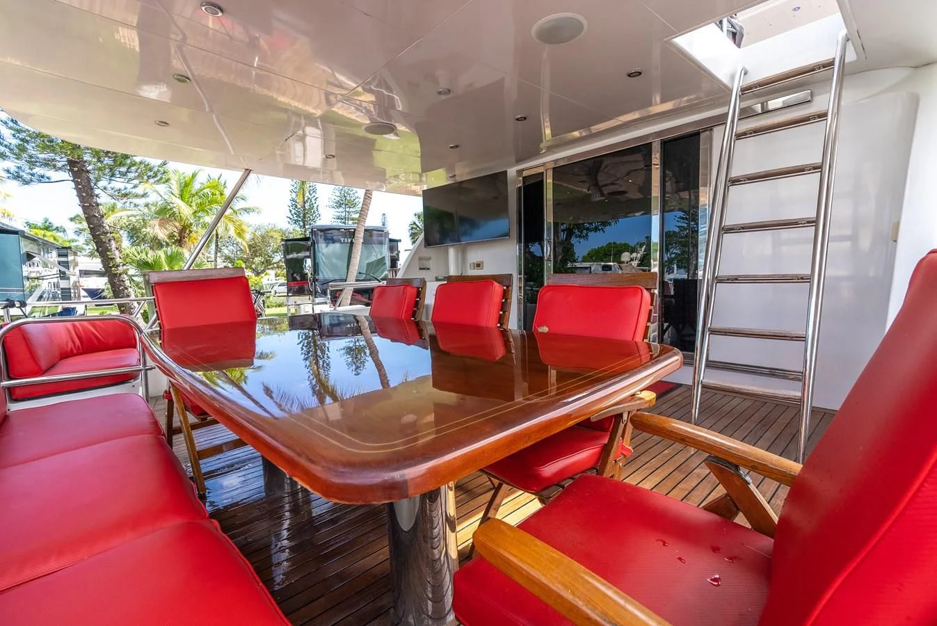 a table with chairs around it aboard SELF MADE Yacht for Sale