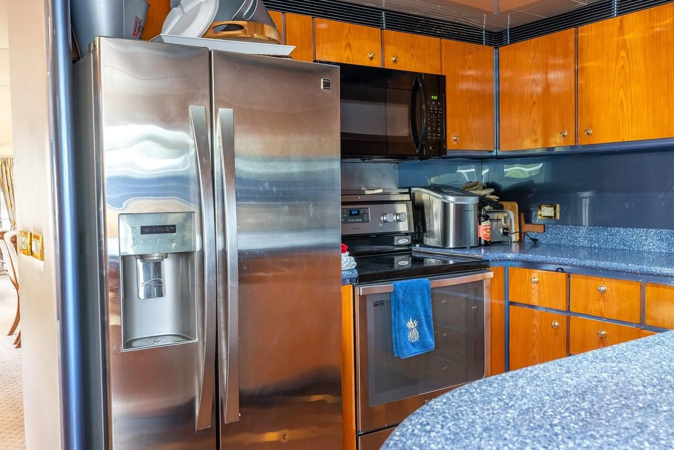 a stainless steel refrigerator in a kitchen aboard SELF MADE Yacht for Sale