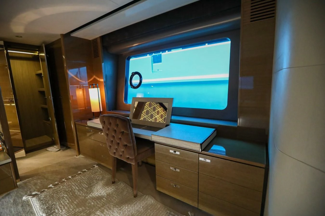 a room with a desk and a large screen aboard M Yacht for Sale