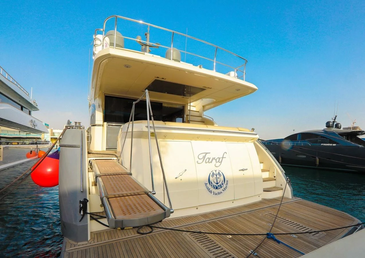 a boat docked at a pier aboard M Yacht for Sale