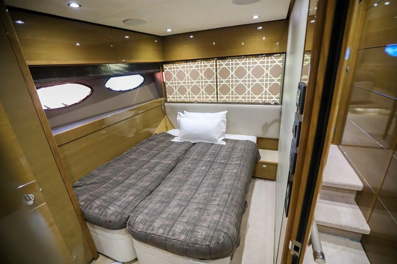 a bed in a room aboard M Yacht for Sale